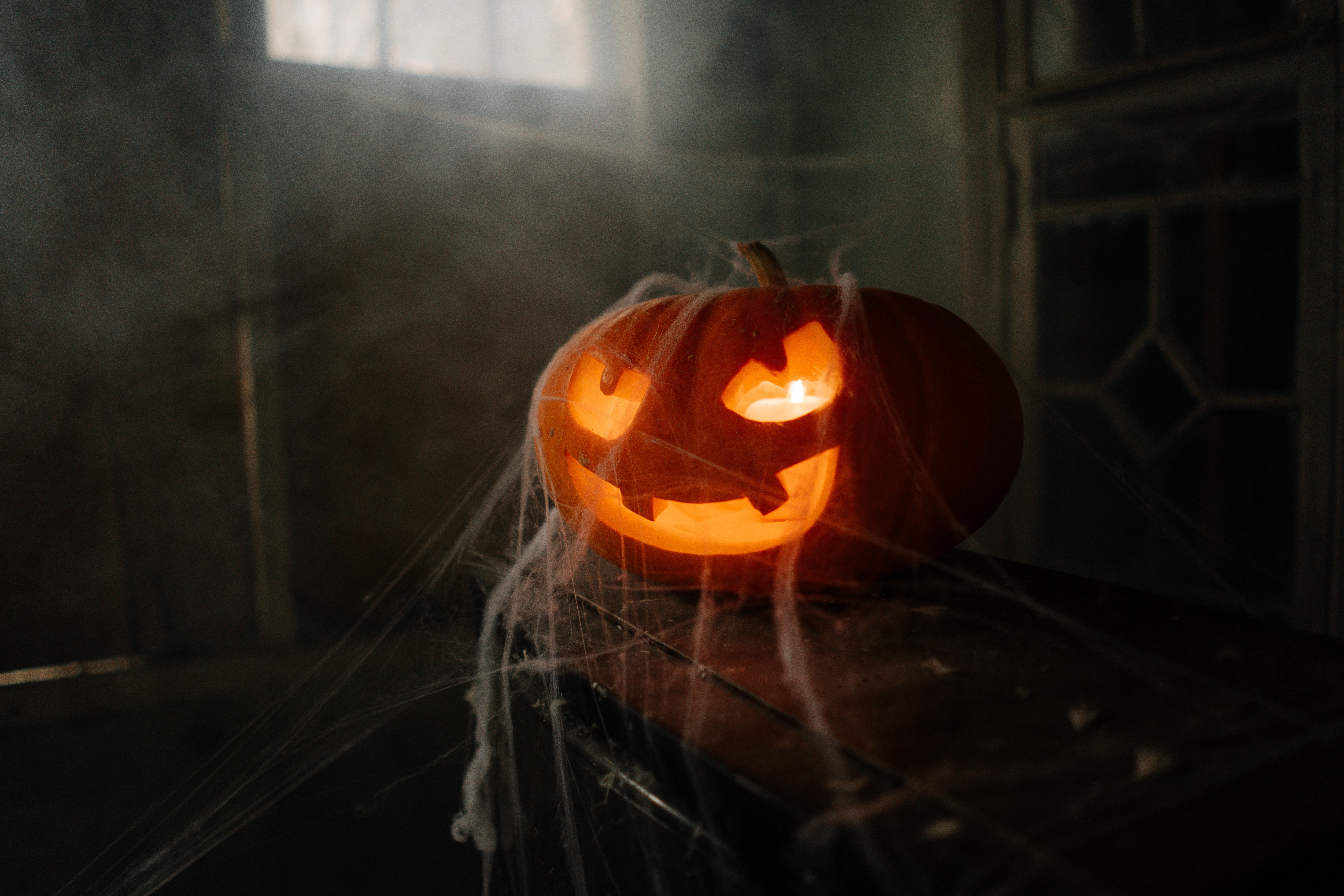 spooky pumpkin in a dark room